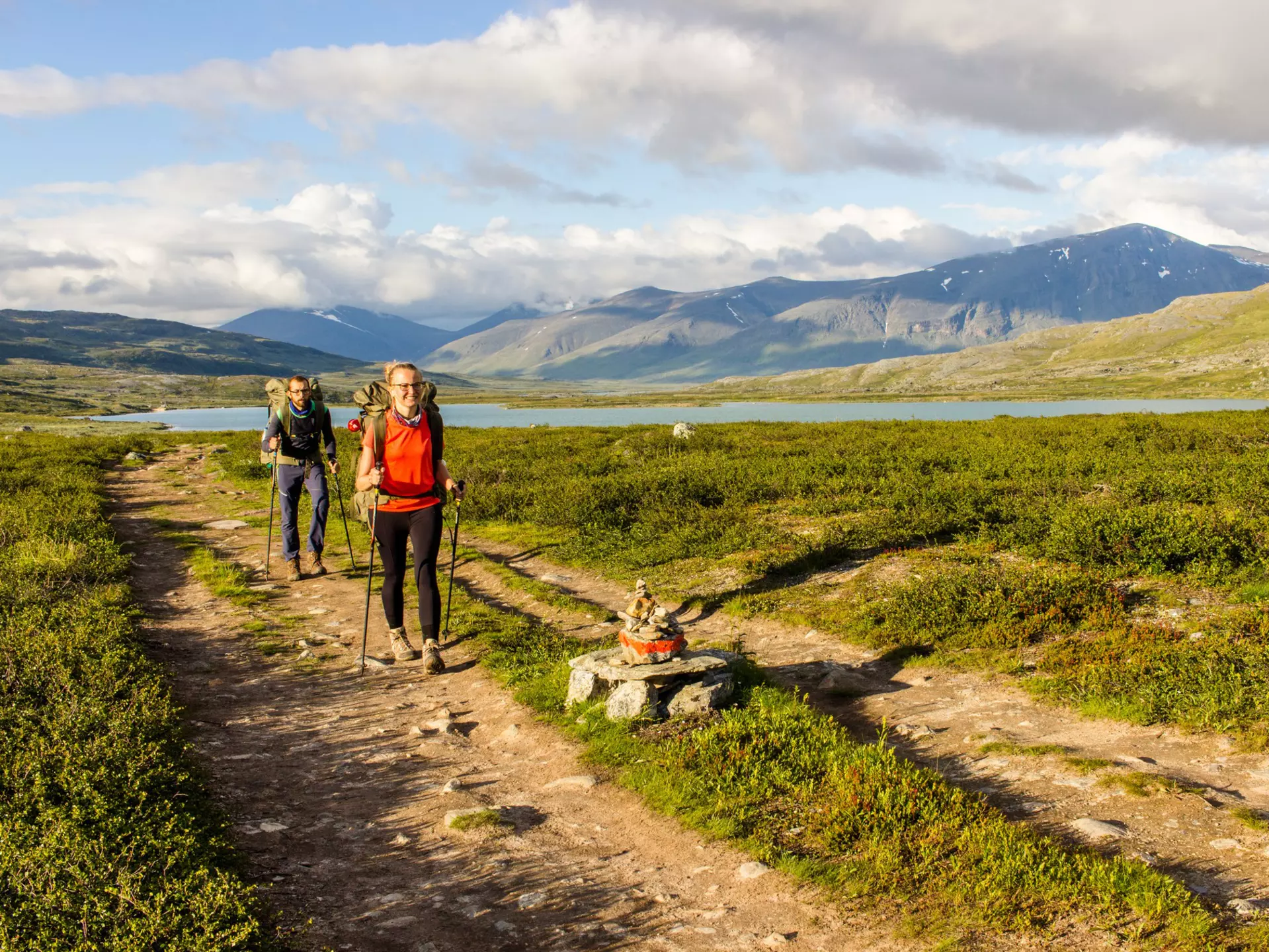 Couple hiking in Swedish north going for the hut.  Side light makes this photo warmer, License Type: media, Download Time: 2025-02-07T08:35:23.000Z, User: pinkjozie64, Editorial: false, purchase_order: 56530 - Guidebooks, job: Global Publishing WIP (for books) , client: Sweden 9, other: Jo-anne Riddell