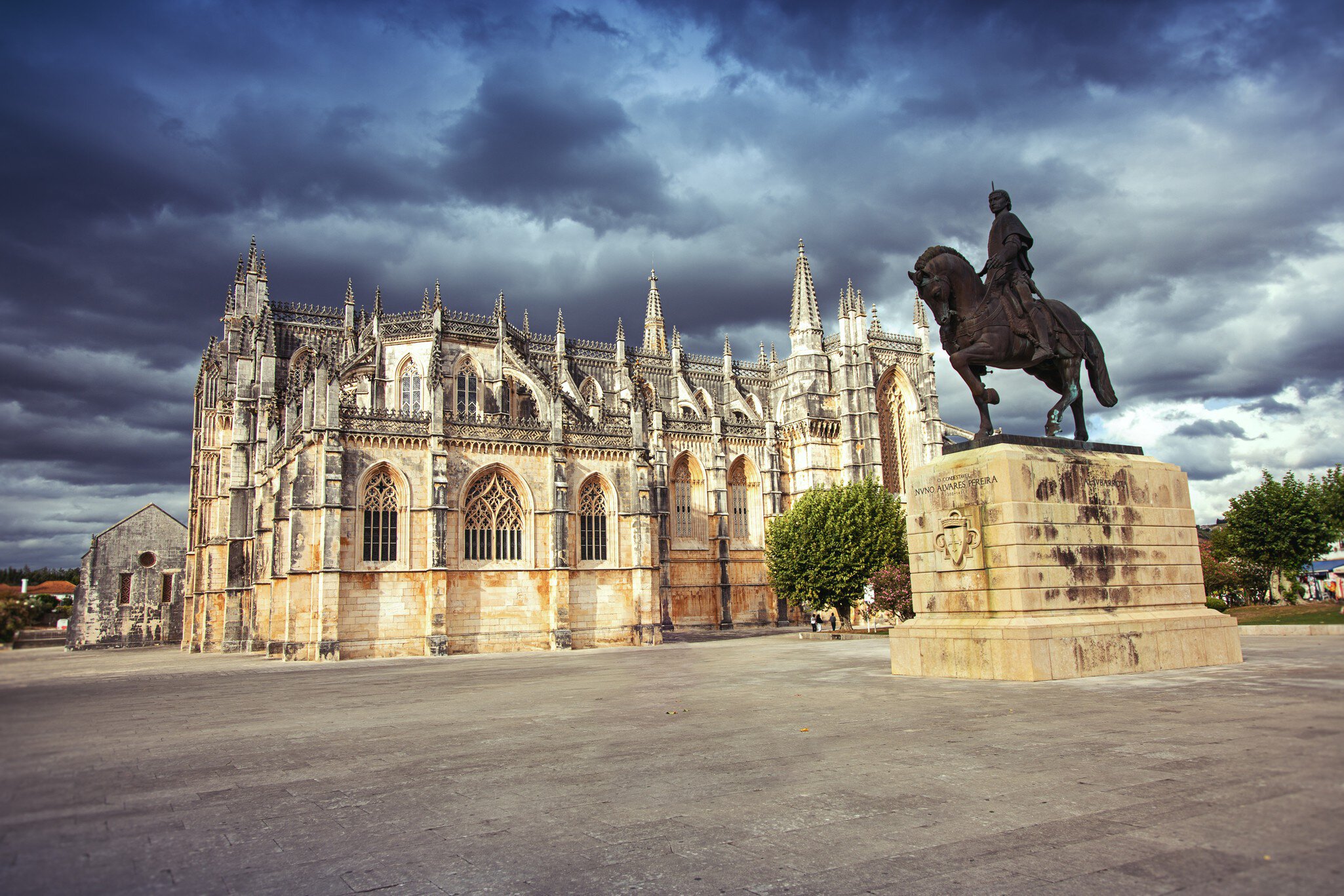 Monastery of Batalha (Monastery of Saint Mary of the Victory) and statue of Nuno Alvares Pereira.