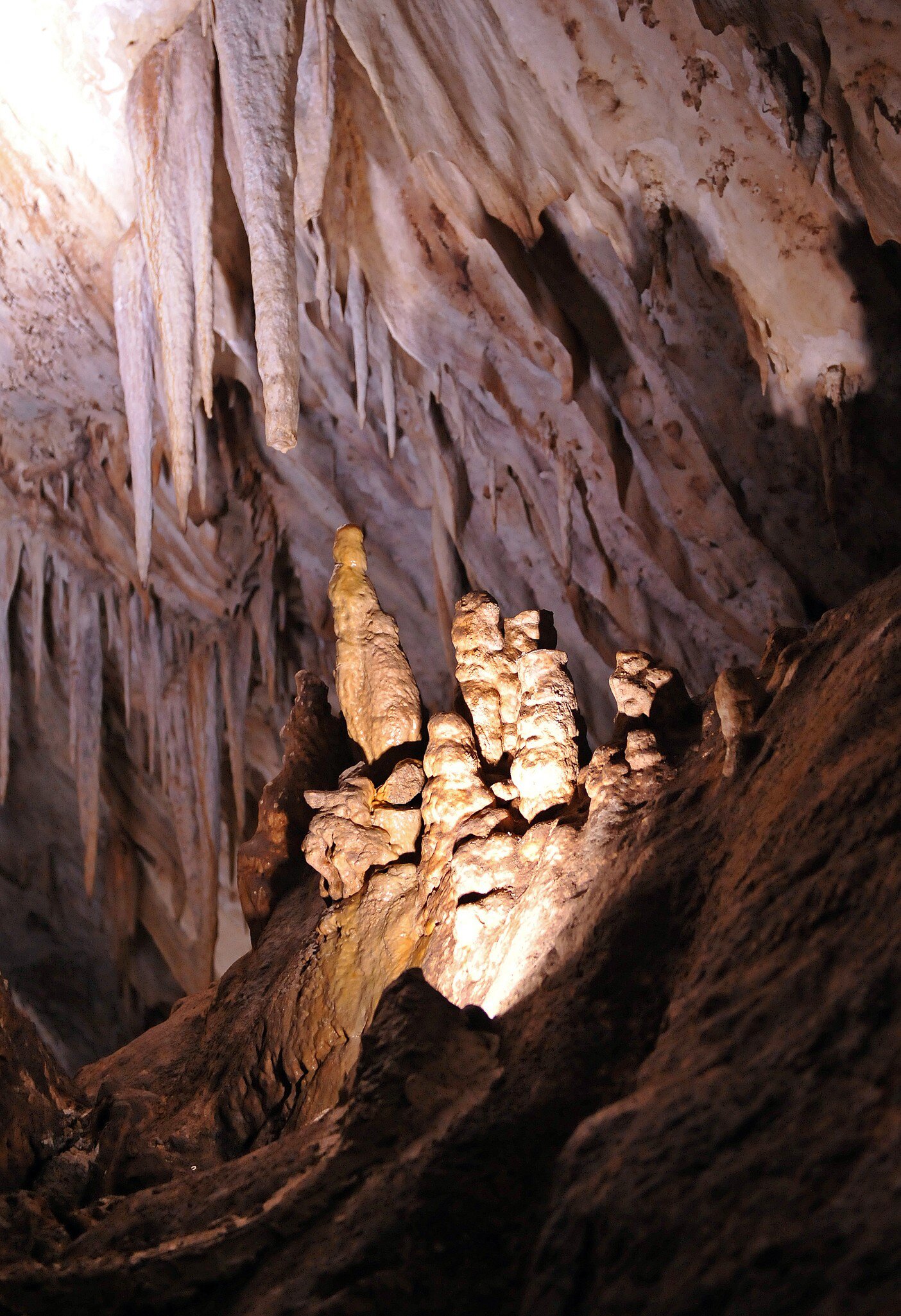 View of illuminated rock formations in the Cueva de los Murcielagos in Zuheros, Spain.