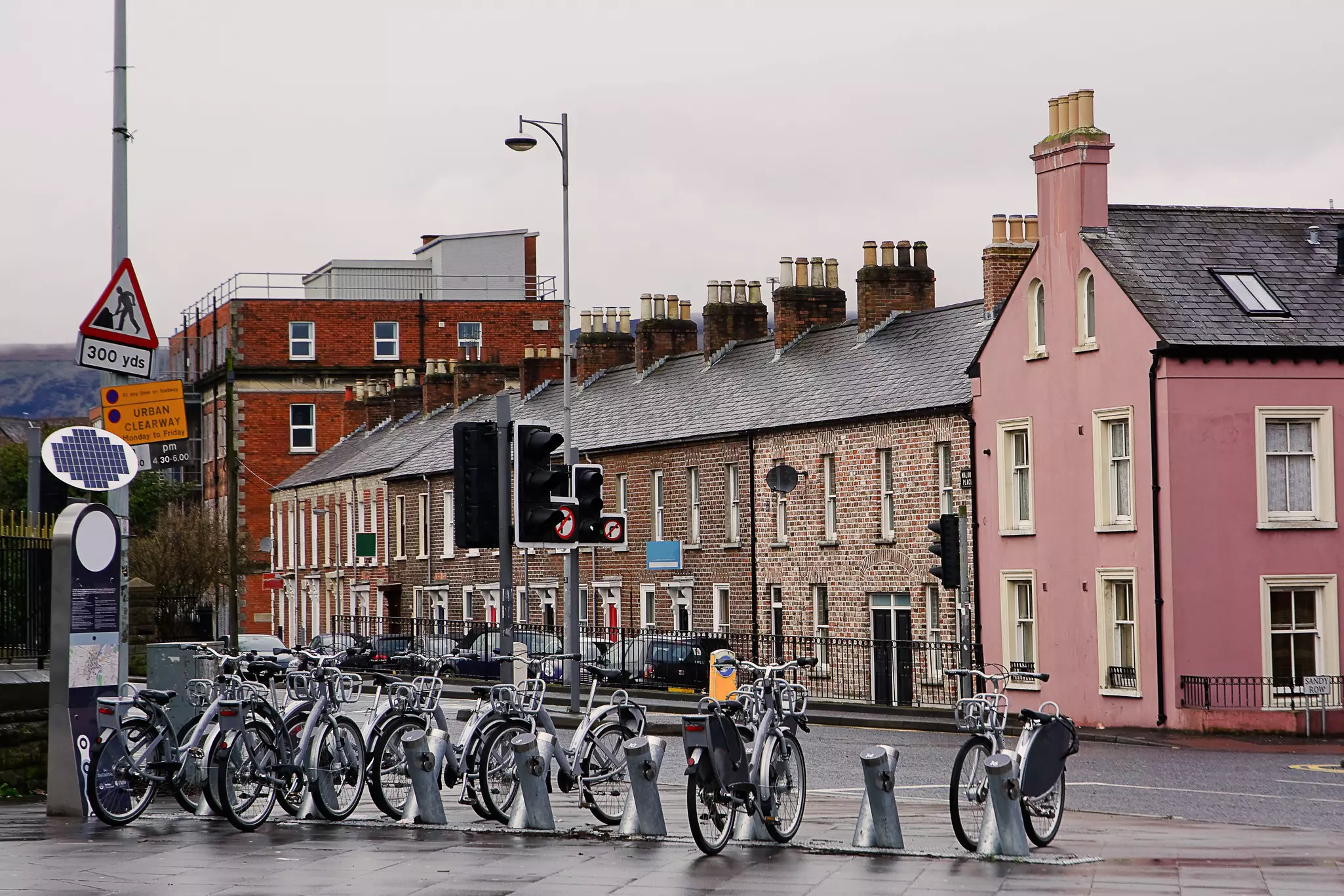 Silver bikes stand at a rack in Belfast waiting to be hired