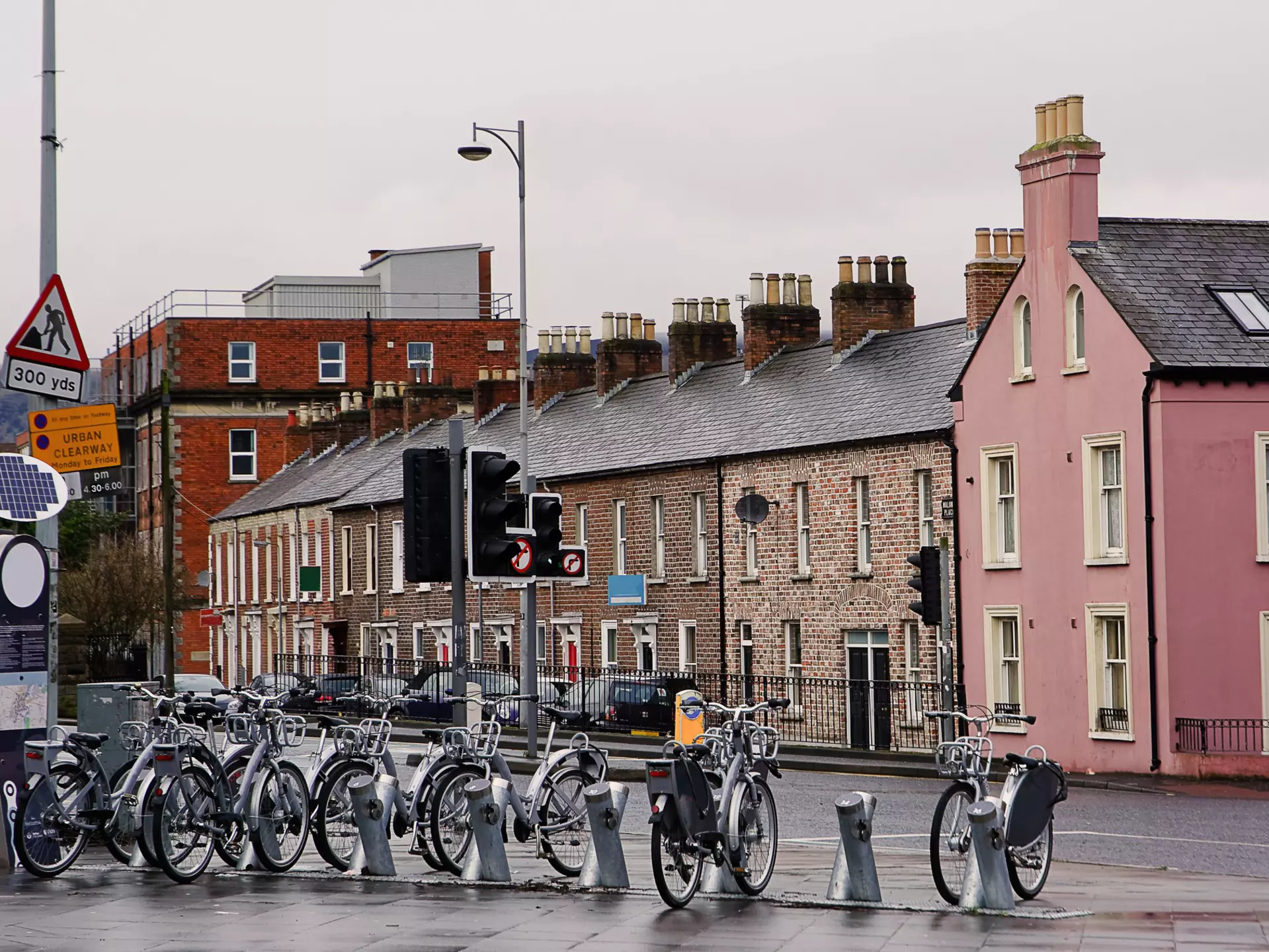 Silver bikes stand at a rack in Belfast waiting to be hired