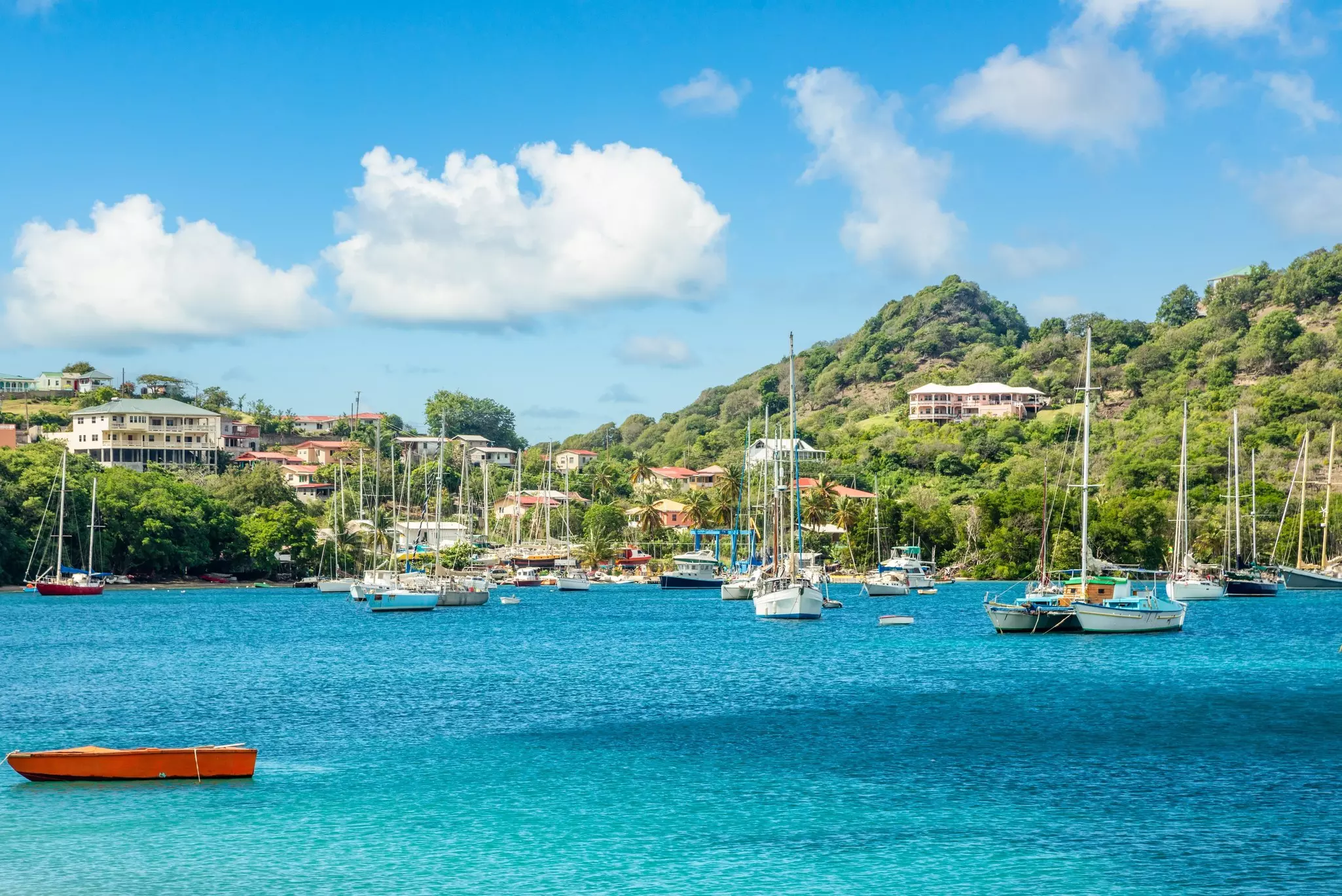 Turquoise colored sea with ancored yachts and boats in the lagoon at Carriacou island, Grenada, Caribbean sea