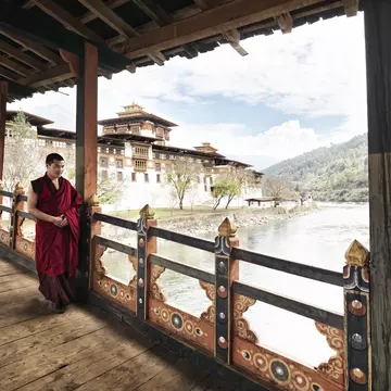 Monk walking on balcony at Punakha Dzong on junction of Pho Chhu and Mo Chhu rivers.
Lonely Planet Traveller Magazine, Issue 40, Bhutan, Kingdom of clouds