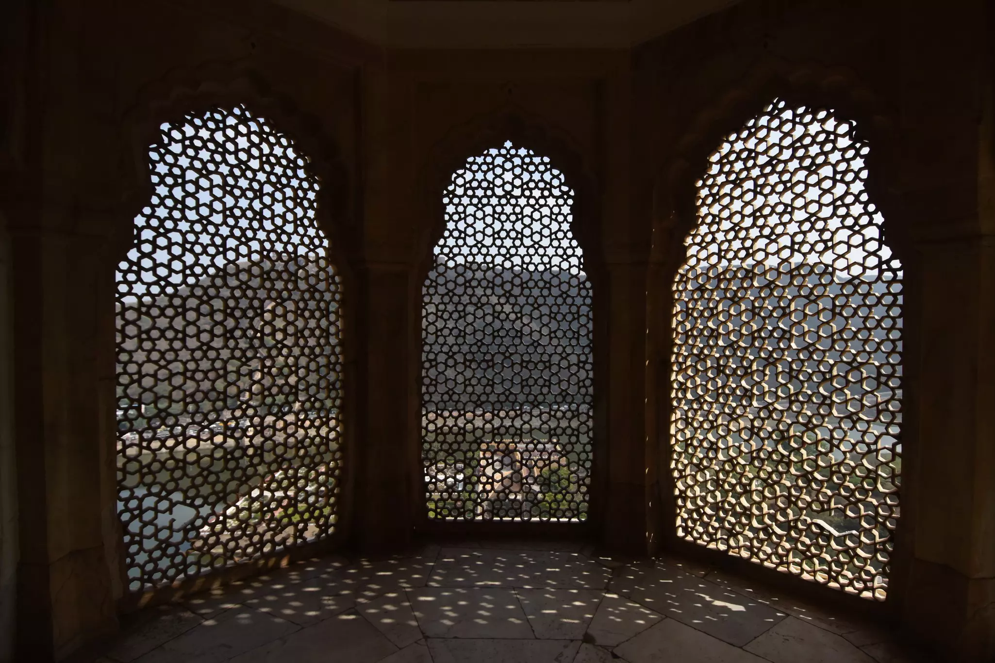 A view of jali screen windows in the royal apartments at Amber Fort, Rajasthan, India.