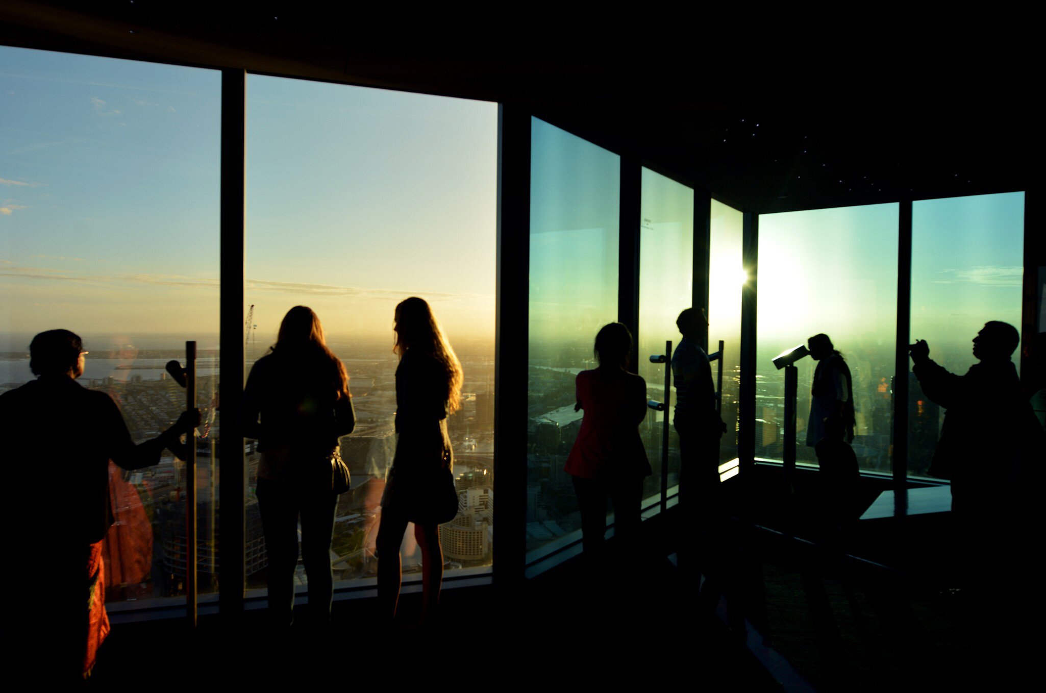 Silhouettes of visitors at Eureka Tower observation deck (Eureka Skydeck 88), the highest public vantage point in a building in the Southern Hemisphere. Melbourne, Australia. 