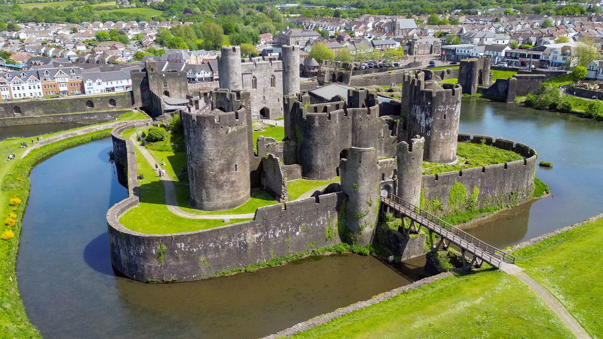 A view of Caerphilly Castle. The best historic sights in Wales span ancient tombs, industrial monuments and castles. Ceri Breeze/Shutterstock