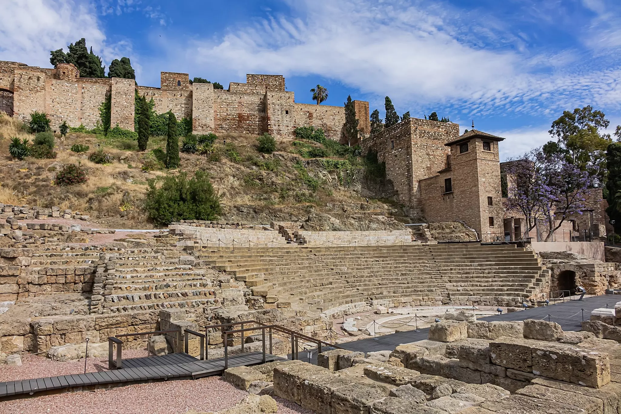 The earth-toned ruins of an ancient Roman amphitheater