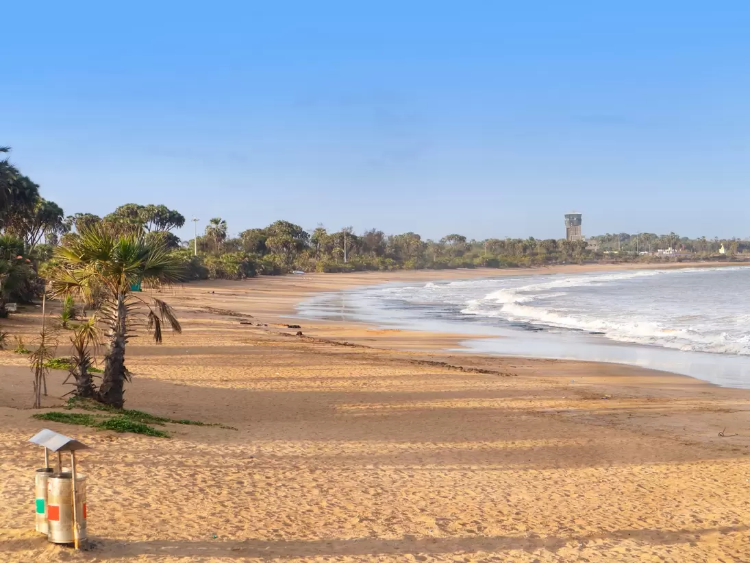 Beautiful empty sandy Nagaon beach with it's blue water in the distance at Diu, Gujarat, India. 