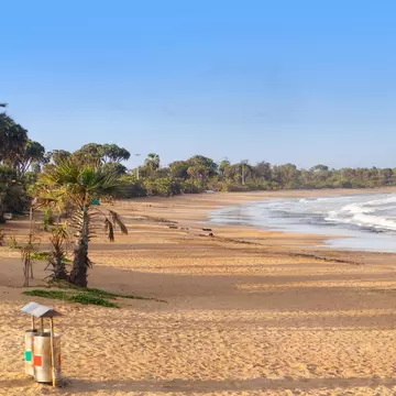 Beautiful empty sandy Nagaon beach with it's blue water in the distance at Diu, Gujarat, India. 