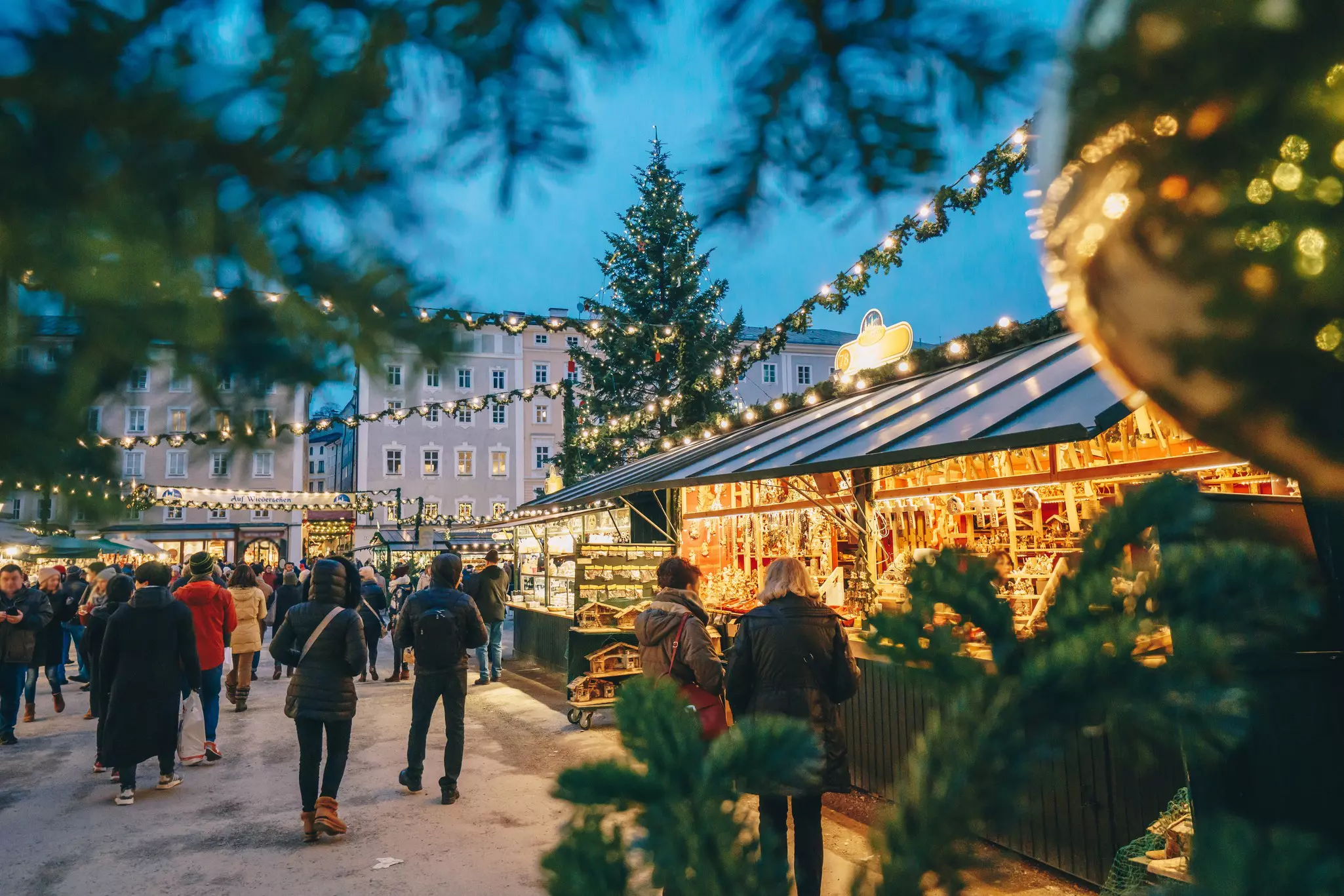 Salzburg Christmas Market seen through Christmas tree branches
