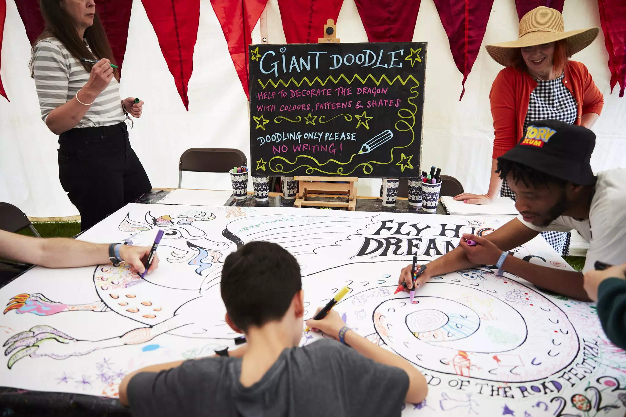 View of people creating in a tent at the End of the Road Festival