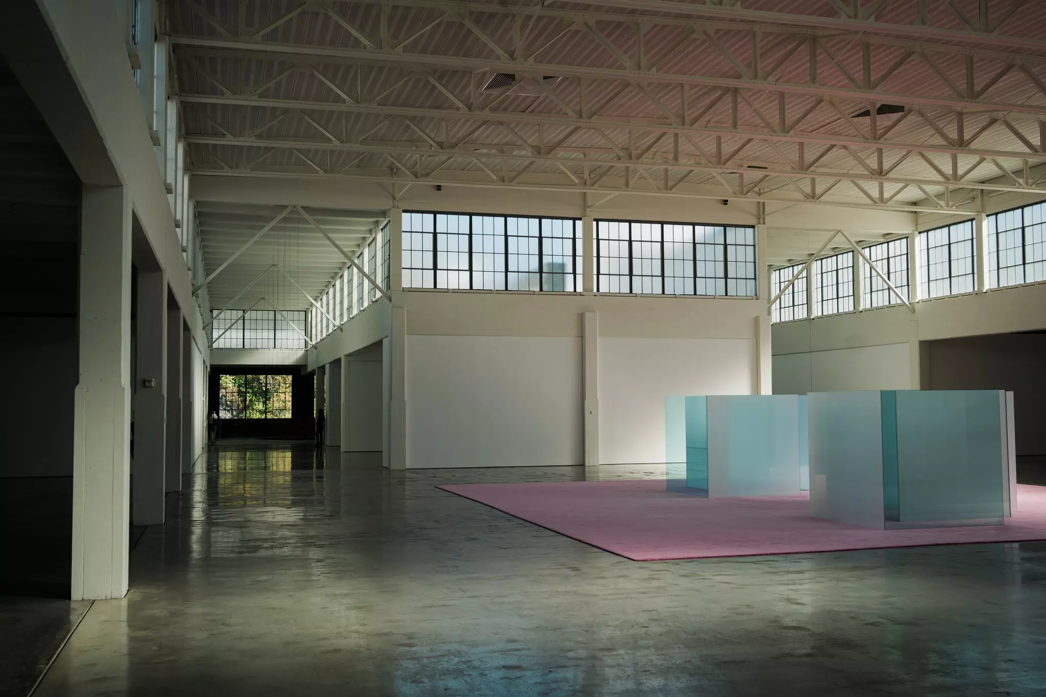 Interior of Dia Beacon. A large, mostly empty space with plenty of windows and a simple art sculpture on display