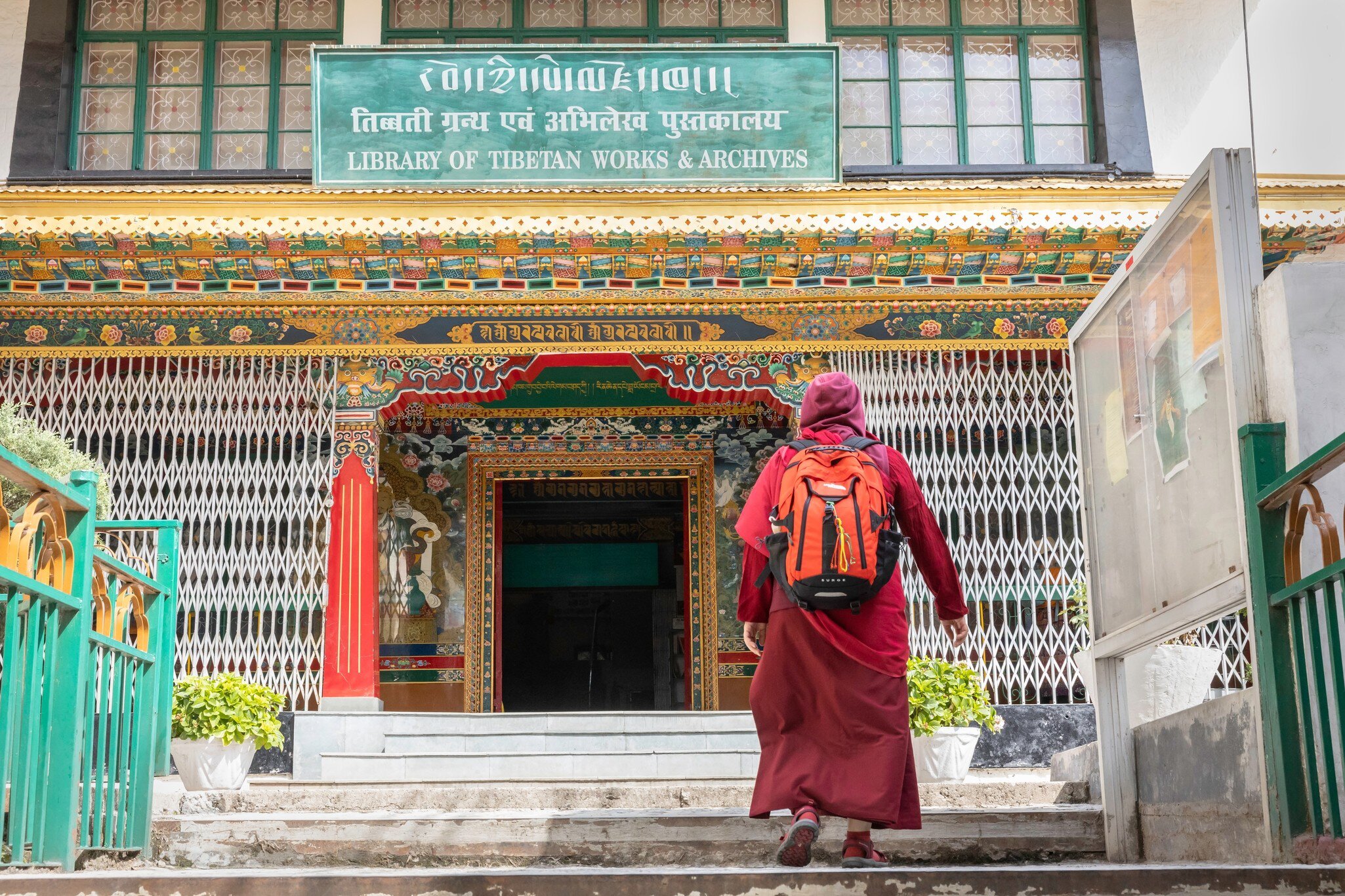 Monk entering in The Library of Tibetan Works and Archives in Himachal Pradesh, India.