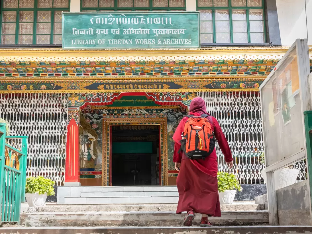 Monk entering in The Library of Tibetan Works and Archives in Himachal Pradesh, India.