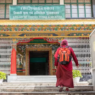 Monk entering in The Library of Tibetan Works and Archives in Himachal Pradesh, India.