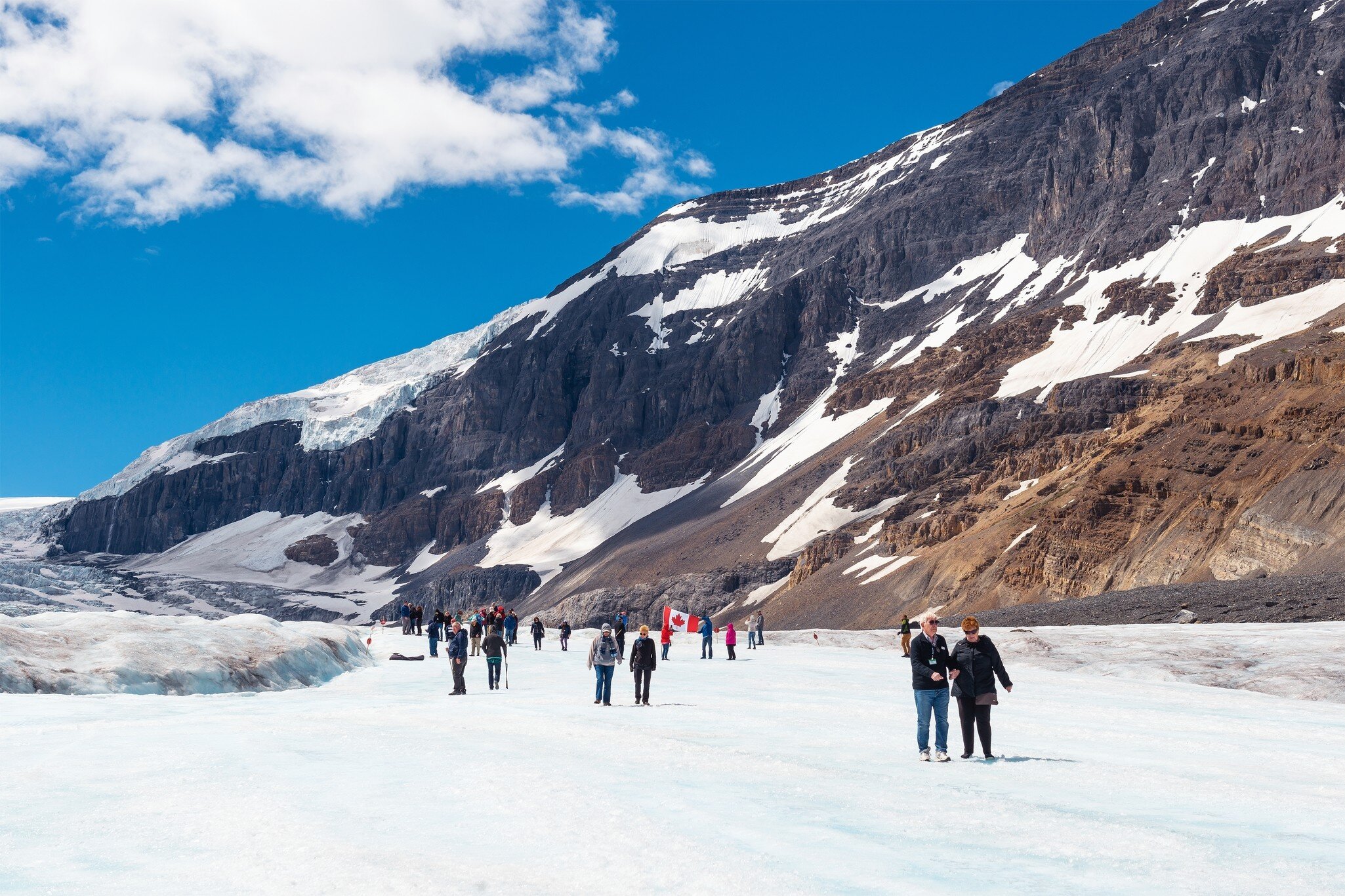 June 7, 2015: The red-white snowcoatch bus carrying tourists to Athabasca Glacier.