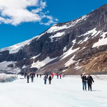 June 7, 2015: The red-white snowcoatch bus carrying tourists to Athabasca Glacier.
