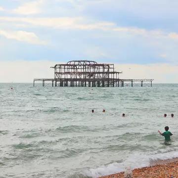 Brighton, East Sussex. 30-07-2025. Beach, West Pier. Children play in the sea. Seagulls in foreground., License Type: media, Download Time: 2026-04-24T23:00:03.000Z, User: LP_ZRay, Editorial: true, purchase_order: 65050 - Digital Destinations and Articles, job: Lonely Planet, client: App Content, other: Zayira Ray