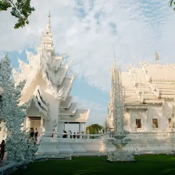 A white temple structure with a many-tiered roof.
