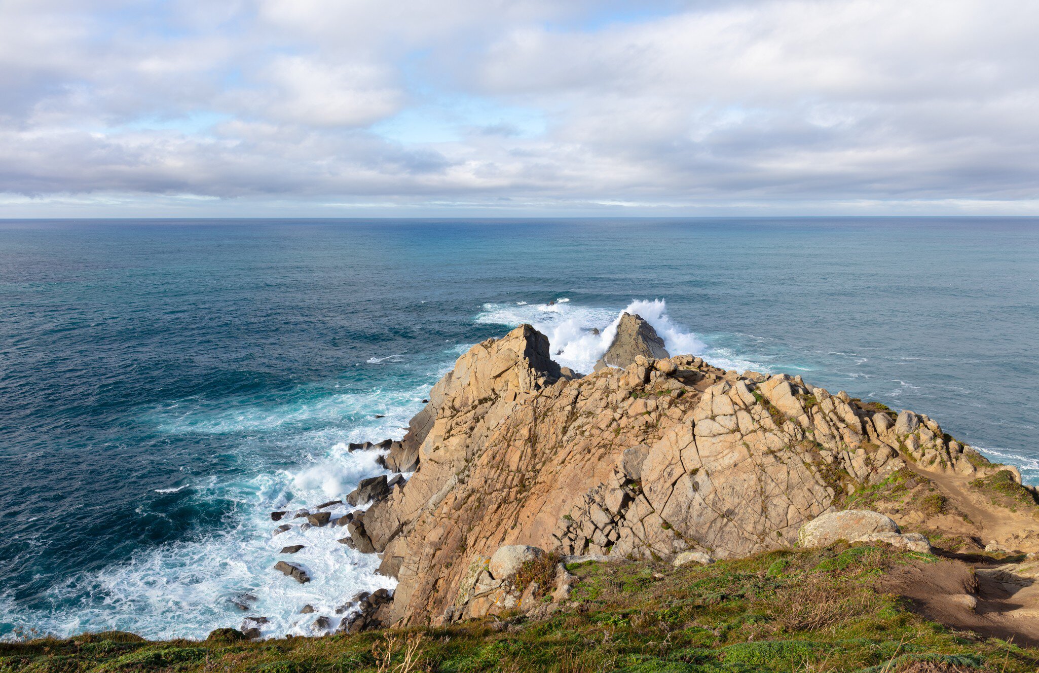 View of waves crashing onto the cliffs at Punta da Estaca de Bares in Galicia, Spain.