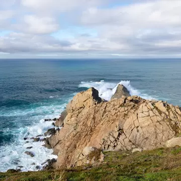 View of waves crashing onto the cliffs at Punta da Estaca de Bares in Galicia, Spain.