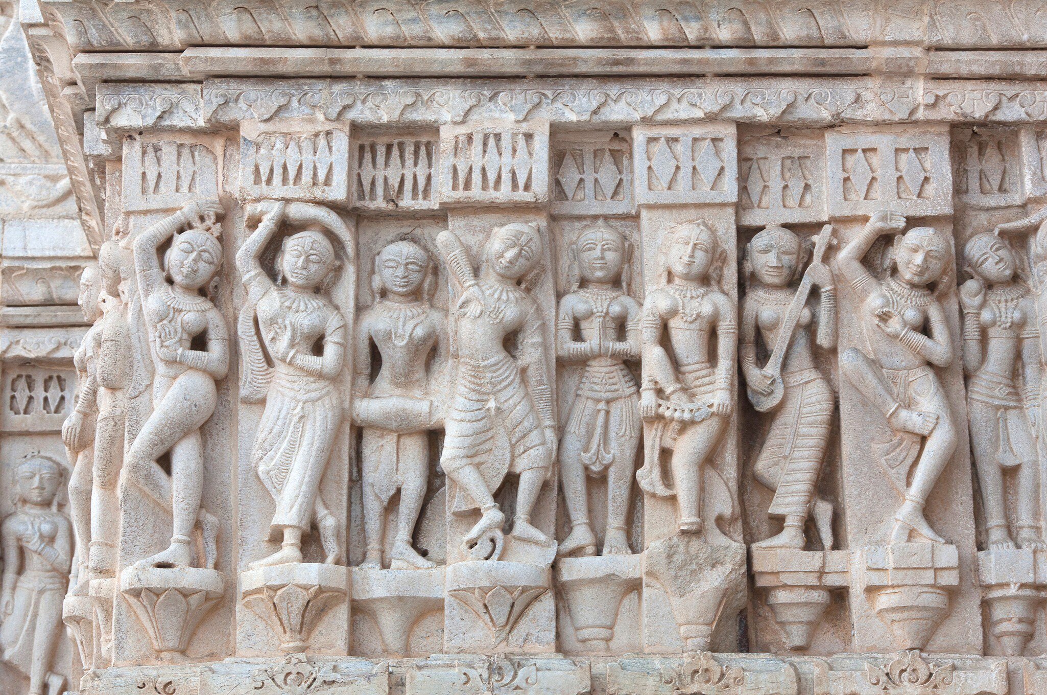 Detail of ancient bas-relief with Apsaras at Jagdish Temple in Udaipur, Rajasthan, India. 