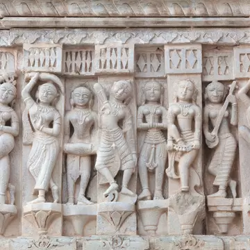Detail of ancient bas-relief with Apsaras at Jagdish Temple in Udaipur, Rajasthan, India. 