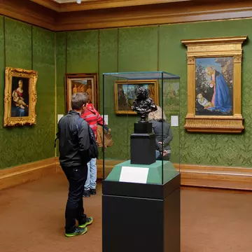 Visitors studying the exhibits within the Scottish National Gallery, Edinburgh.