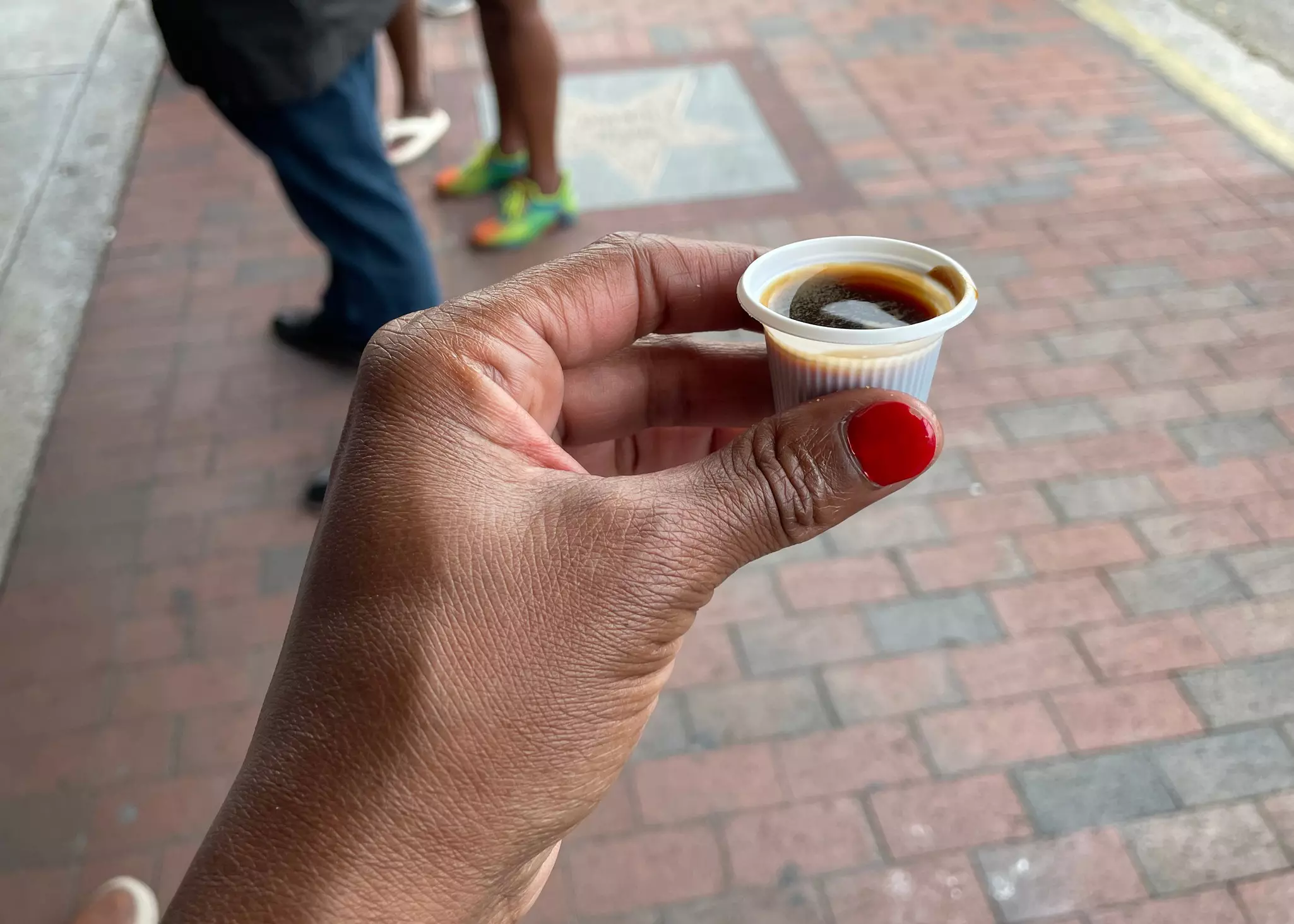 Savoring a thimble-sized measure of Cuban coffee from a no-frills ventanita is the classic cafecito experience © Madiha Brooks / Getty Images