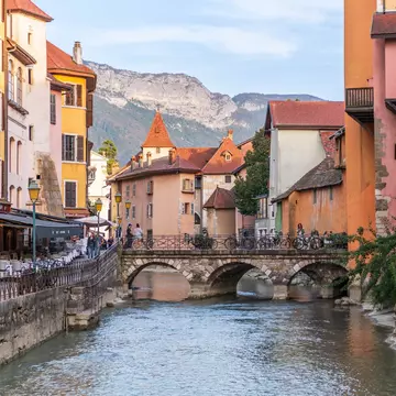 The River Thiou in Annecy with colorful buildings on both banks. 