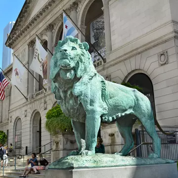 A pair of bronze lions by sculptor Edward Kemeys flank the main entrance of The Art Institute of Chicago. Steve Cukrov/Shutterstock