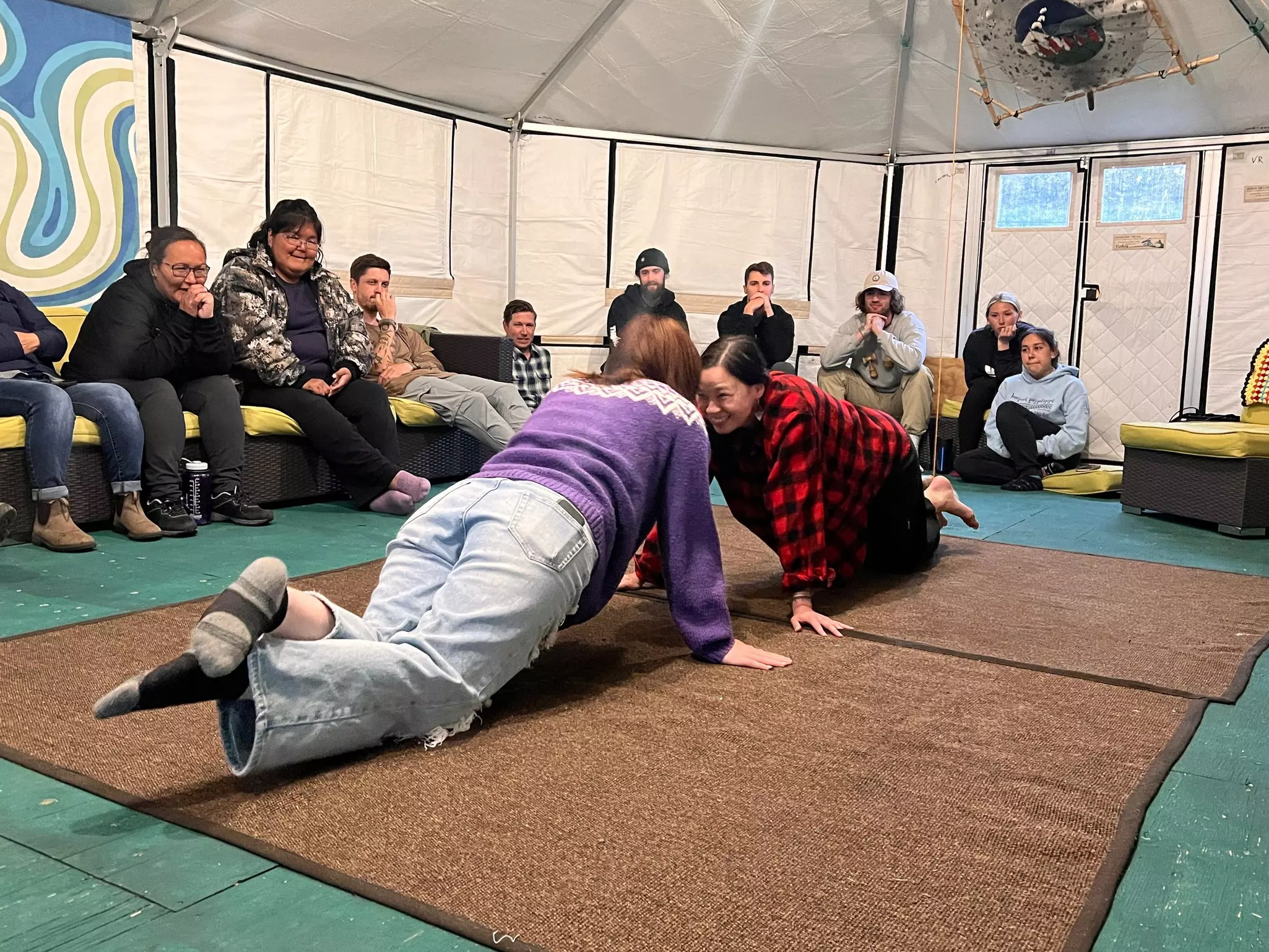 From high kicks and hopping to leg wrestling, Inuit games require balance, strength and control — closely mimicking the skills necessary to be a successful hunter © Liz Beatty