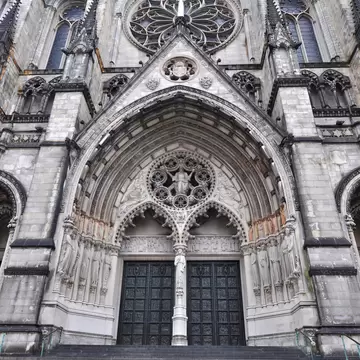 Exterior with many gothic details against a deep blue sky of the gothic medieval cathedral of Saint John, one of the top attractions of Den Bosch, 's-Hertogenbosch, Netherlands; Shutterstock ID 180468908; Your name (First / Last): Josh Vogel; Proj...
