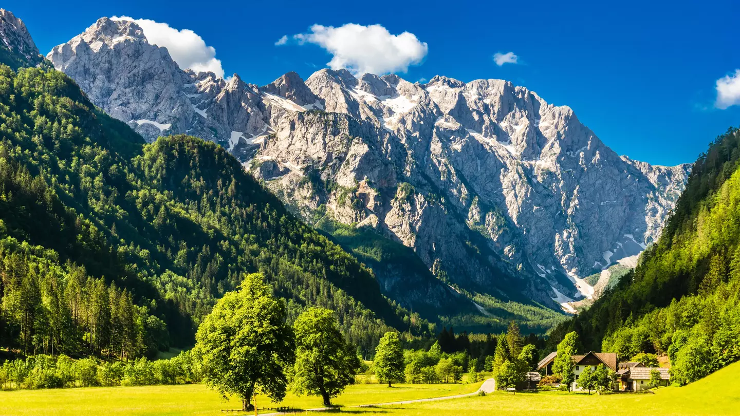 Sunlight meadows and mountains in the Logar Valley