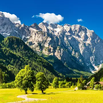 Sunlight meadows and mountains in the Logar Valley