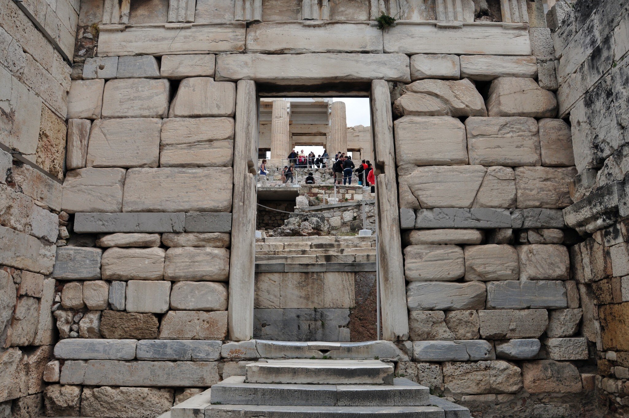 ATHENS, GREECE - MAY 6, 2014: Visitors at the Propylaia and the Beule Gate west entrance to the Acropolis of Athens, Greece.; Shutterstock ID 206520655; your: Erin Lenczycki; gl: 65050; netsuite: Digital; full: POI