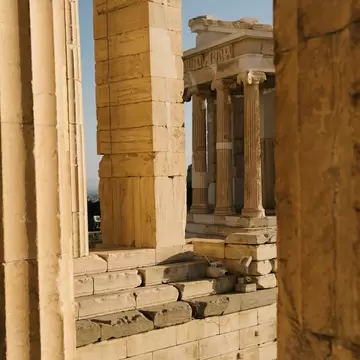 White marble columns in warm light.