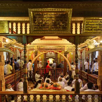 Interior of the Temple of the Sacred Tooth Relic in Kandy, Sri Lanka, a revered Buddhist site housing Buddha’s tooth relic.