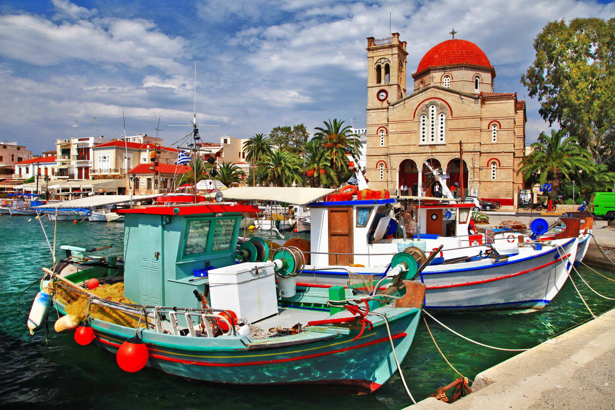 Colourful boats docked at the Port of Aegina.
174712496
sky, sea, town, quay, gulf, port, blue, boat, shore, hills, greek, yacht, front, homes, house, water, hotel, cruise, island, travel, marina, greece, summer, aegean, lagoon, window, church, aegina, europe, harbor, saronic, holiday, village, tourist, tourism, seafront, building, colorful, vacation, mountains, pictorial, landscape, varicolored, architecture, mediterranean