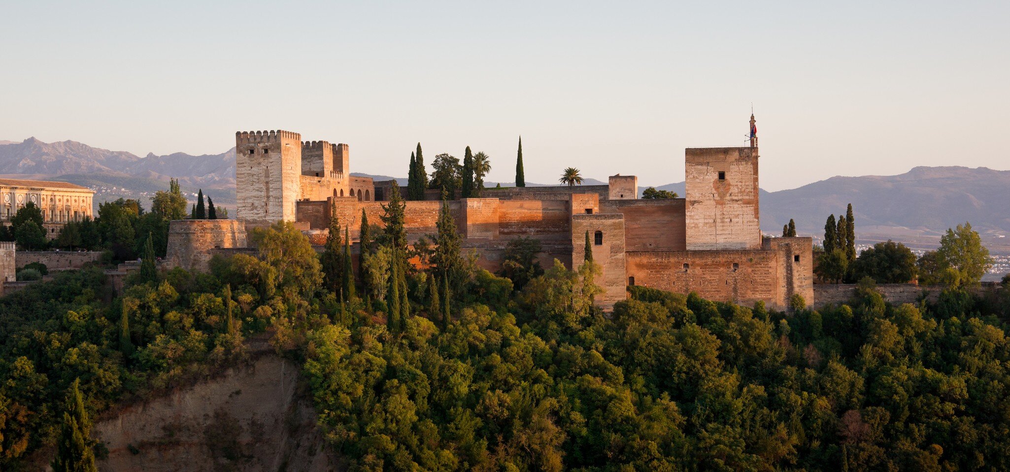 Alcazaba Alhambra Golden Hour Panorama in Granada, Spain. This photograph was taken at twilight from San Nicolas church in Albaicin.