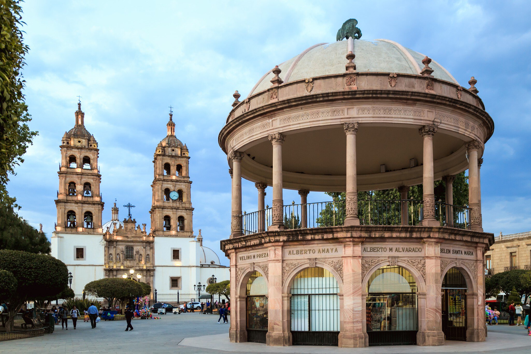 Durango, Mexico, April 2019. Catedral de Durango (Durango Cathedral)  and "Plaza de Armas". The names of the city founders are written with copper letters at the top of the kiosk. ; Shutterstock ID 1381763180; purchase_order: 65050; job: POIs; cli...