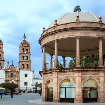 Durango, Mexico, April 2019. Catedral de Durango (Durango Cathedral)  and "Plaza de Armas". The names of the city founders are written with copper letters at the top of the kiosk. ; Shutterstock ID 1381763180; purchase_order: 65050; job: POIs; cli...