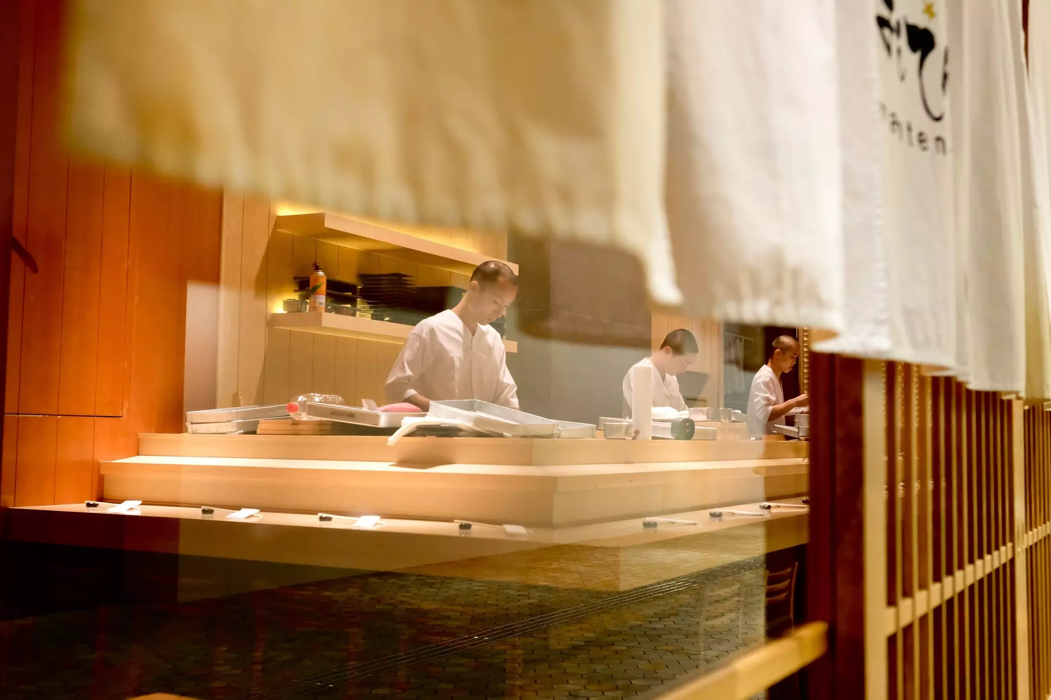 Sushi chefs preparing to serve an omakase lunch