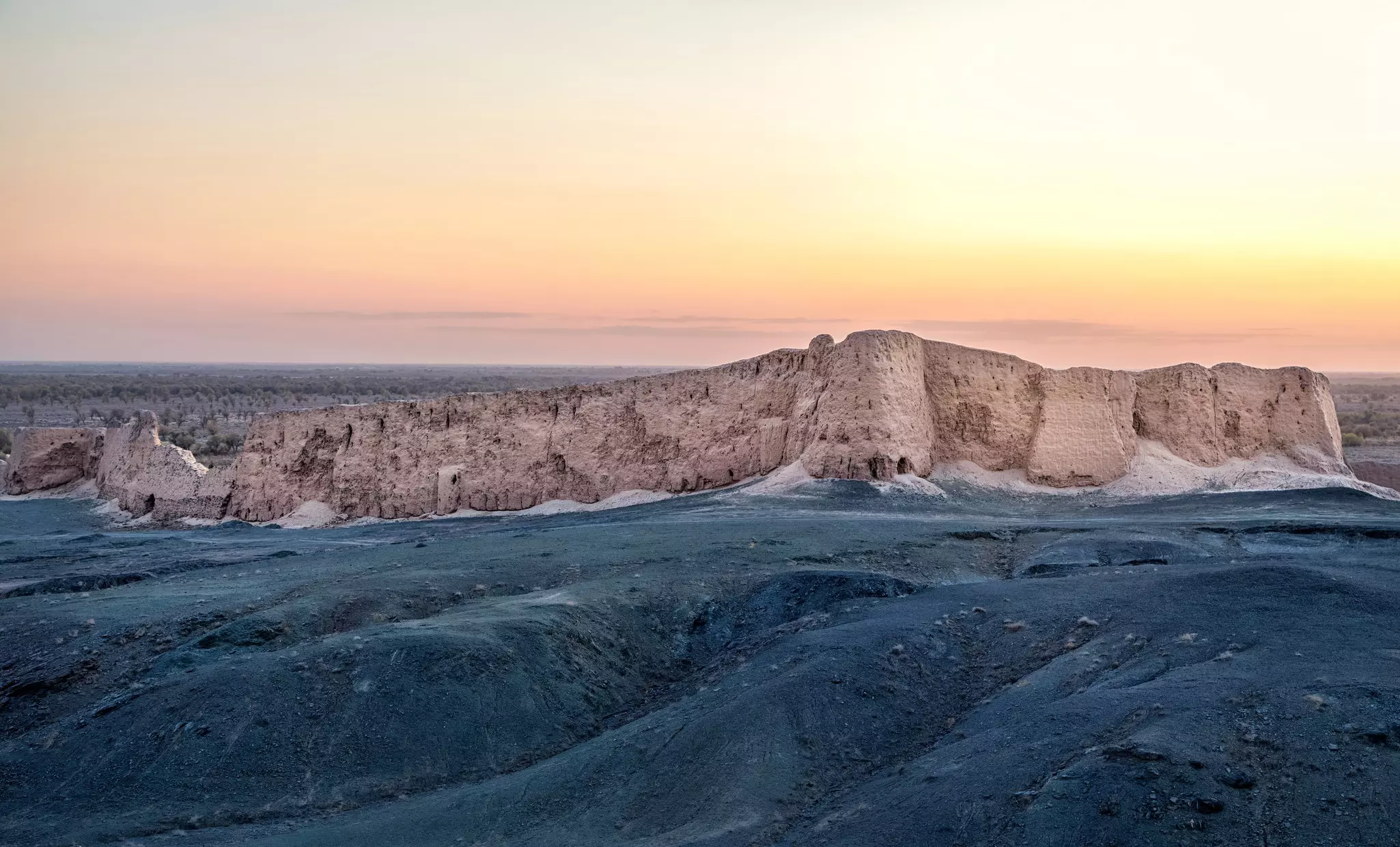 Wall of Djanpik Qala: 9-10th century Khorezm fotress on sunset, Karakalpakstan region, Uzbekistan.