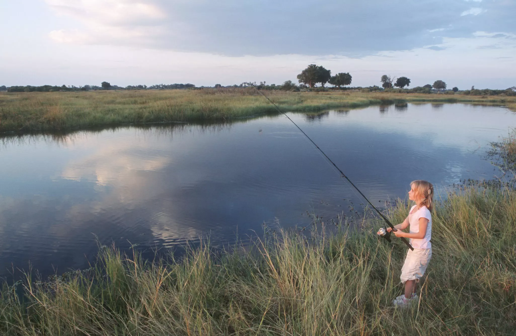 Young kids might like to try fishing in the Okavango Delta, Botswana ©Dave Hamman/Getty Images