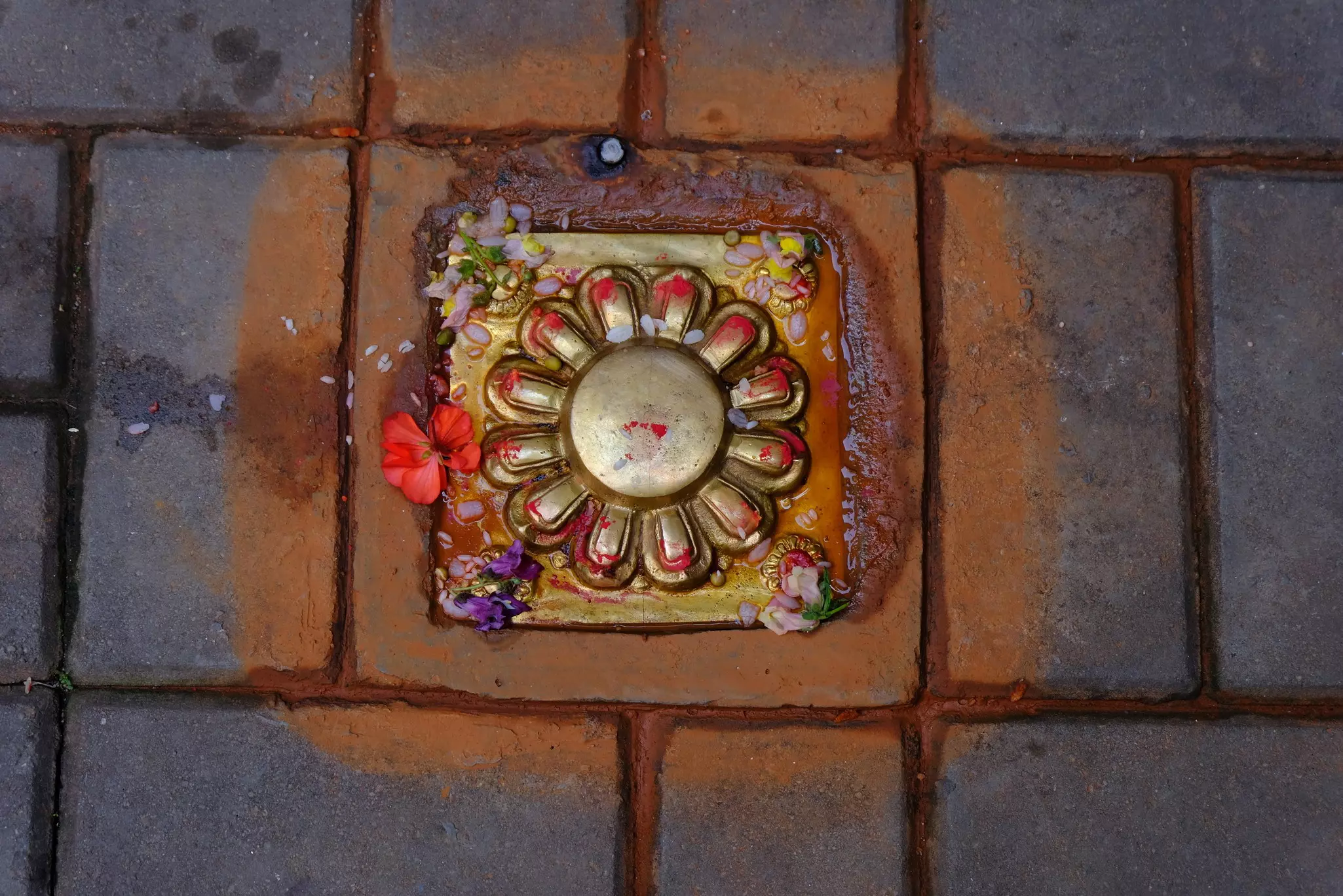 A brass pikhalukhu symbol outside a home in Patan, Nepal.