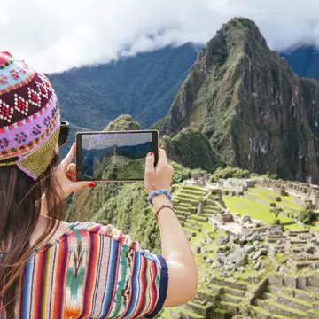 Peru, woman taking pictures of Machu Picchu citadel and Huayna Picchu mountain with a tablet
People Symbol Communication History Lifestyles Nature Technology Travel Destinations Horizontal Outdoors 30-34 Years Rear View South America Caucasian Ethnicity Tourist Old Ruin Peru Multi Colored Famous Place Cloud - Sky Mountain Mountain Range Mountain Peak Day Andes Machu Picchu Traditional Clothing One Person Inca Adult Mid Adult 30-39 Years Cusco Region Color Image Knit Hat Women Mid Adult Women One Mid Adult Woman Only Only Women One Woman Only Looking At View Photography Bobble Hat Digital Tablet Convenience Photographing Tourism Photography Themes Computer Travel Mt Huayna Picchu Vibrant Color Wireless Technology Adults Only incan empire UNESCO World Heritage Site Mini Tablet Inca Ruins