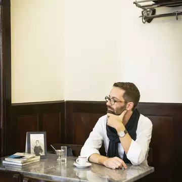Novelist in Martinho da Arcada – a café historically frequented by Portuguese modernist poet Fernando Pessoa.