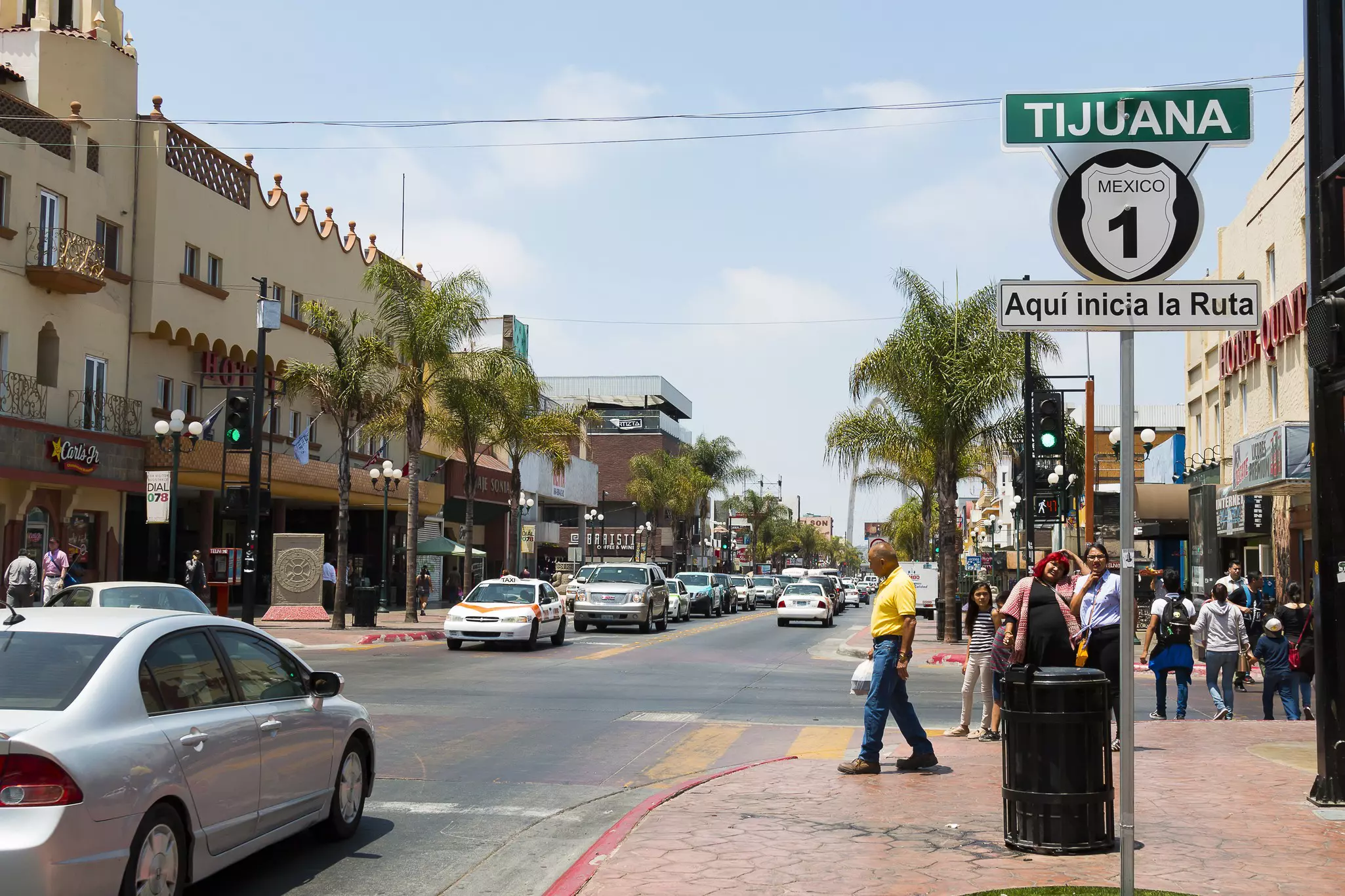 People walk along Avenida Revolucion, the city's main thoroughfare and a popular destination for Americans traveling south of the San Diego border.