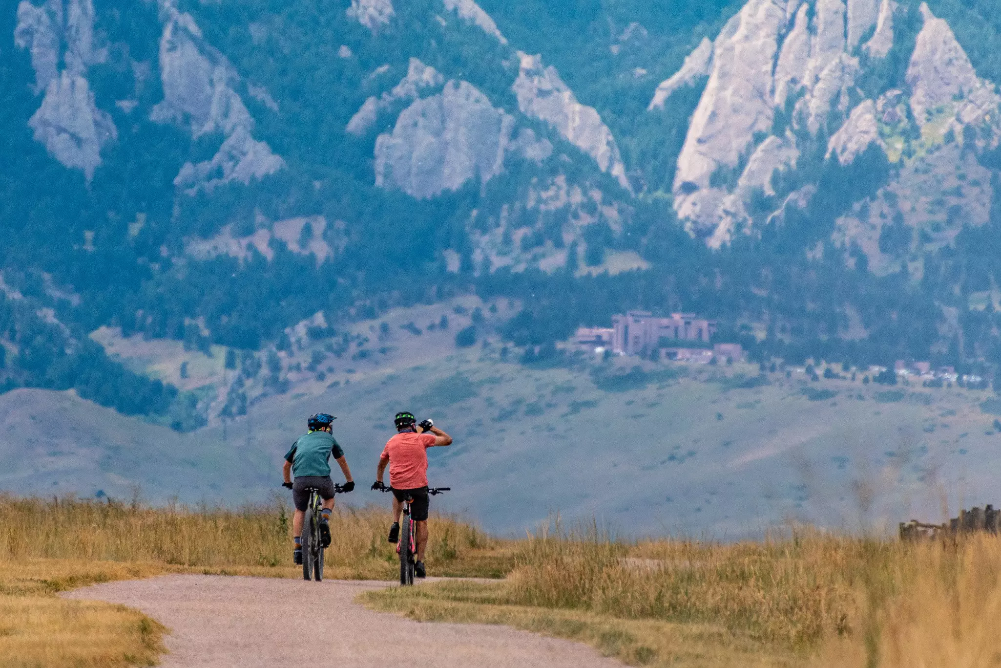 Two bikers riding through the Boulder Valley early in the morning